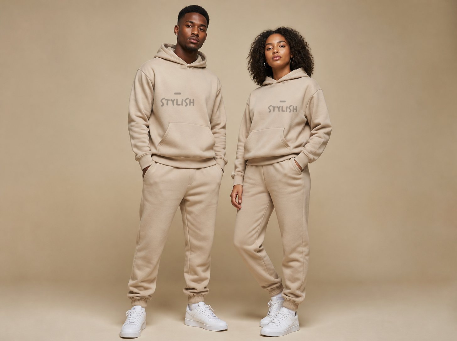 Two models in the stone hoodie and jogger set